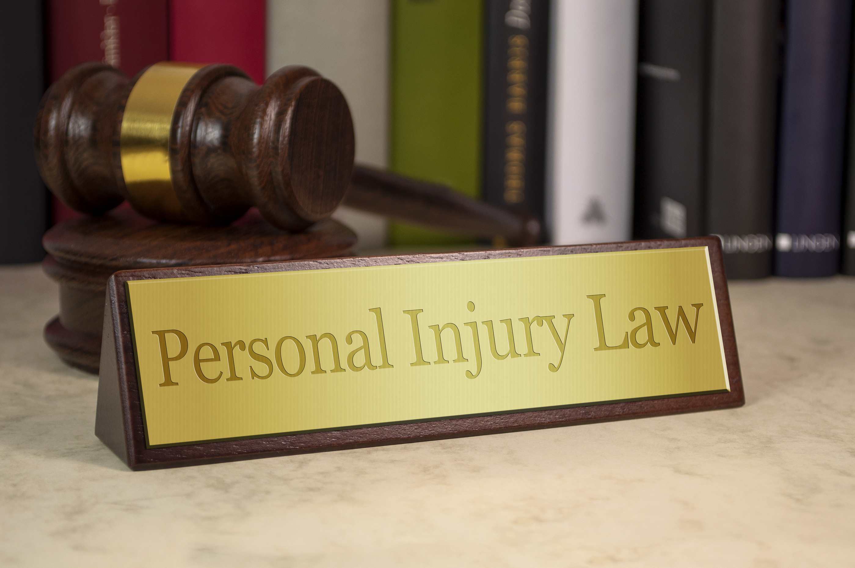 Denver Personal Injury Attorney About Us Photo Denver Personal Injury Attorney personal injury law name plaque - About Us Photo